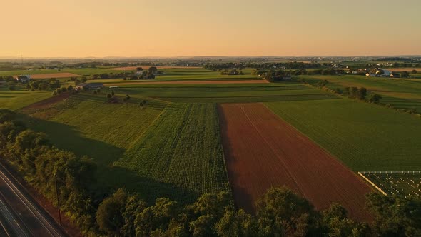 Aerial View of Amish Farms and Fields During the Golden Hour on a Late Summer Afternoon