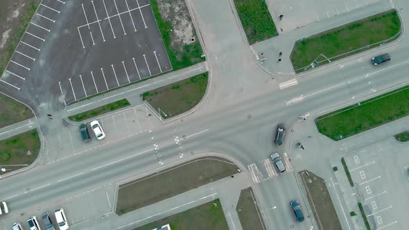 Drone View of an Intersection with Cars and Pedestrians in the City