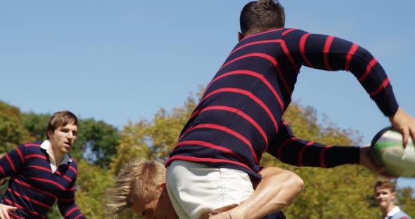 Rugby player tackling oval ball 4K 4k