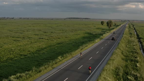 The Cyclist is Driving Fast on the Highway