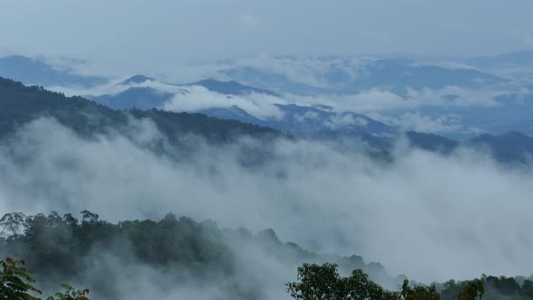 4K Beautiful mountains filled with fog.