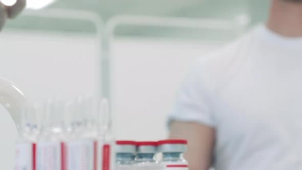 Close Up of a Syringe Getting Filled with Vaccine