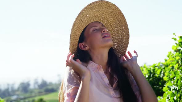 Woman standing in vineyard