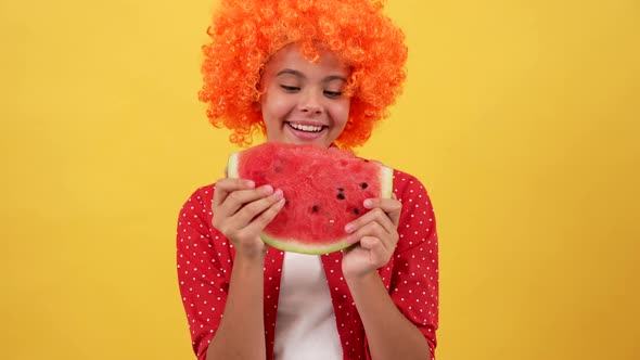 Happy Kid in Orange Hair Wig Eating Slice of Watermelon Fruit on Yellow Background Watermelon