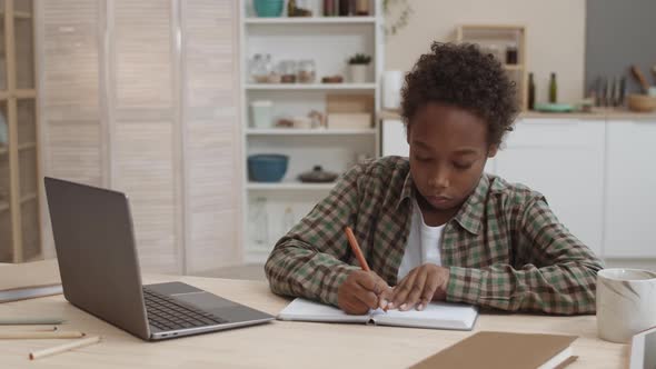 Boy Getting Tired of Doing Homework