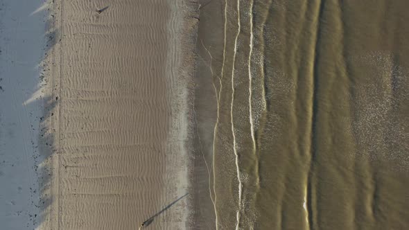 Aerial bird's eye drone view over Irish beach