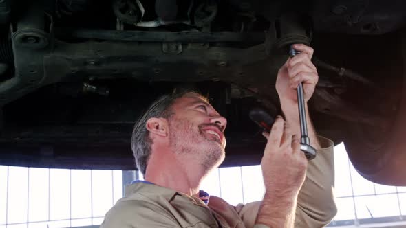 Mechanic servicing a car