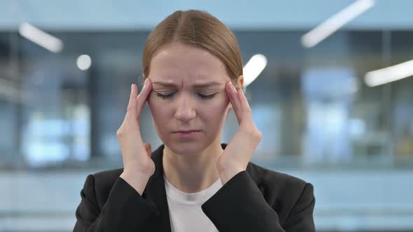 Portrait of Businesswoman Having Headache