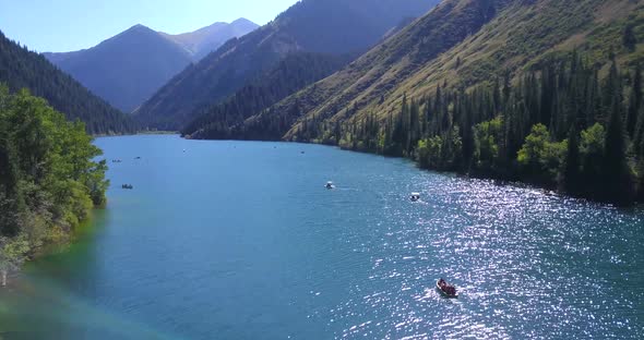 Kolsay Lake Among Green Hills and Mountains.