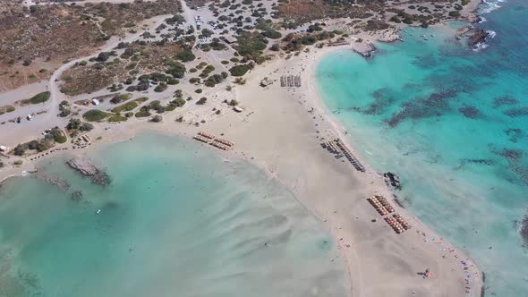 Aerial bird view of a paradise beach with umbrellas. Idyllic vacation