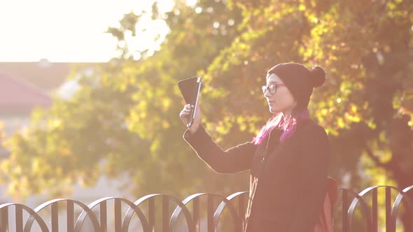 Womanstudent in Glasses Taking Selfie