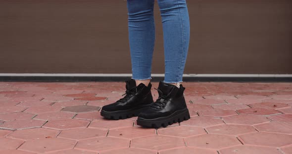 Women's Boots Jumping on the Street