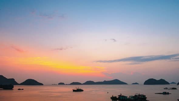 Time lapse: Vietnam Cat Ba bay at sunset to night with floating fishing boats on sea