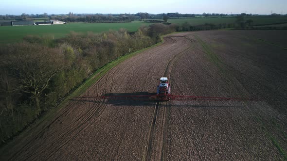 Farmer Spraying Fields on an Arable Farm with Glyphosate Herbicide