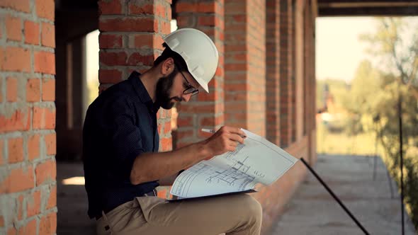 Developer Builder Contractor Foreman Read Blueprints.Designer On Construction Site.Engineer Foreman