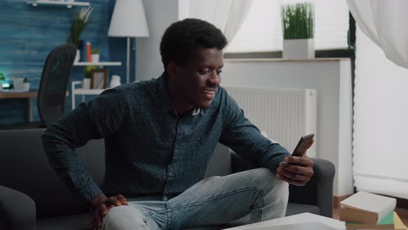 African American Guy on Online Video Call Using Phone