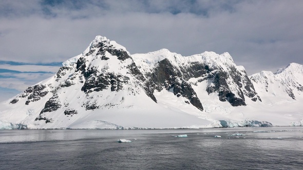 Arctic landscape with mountains, icebergs and glaciers. Climate Change and Global Warming