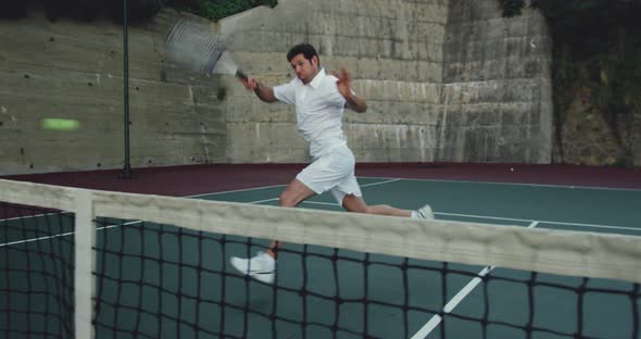 Man playing tennis on a sunny day