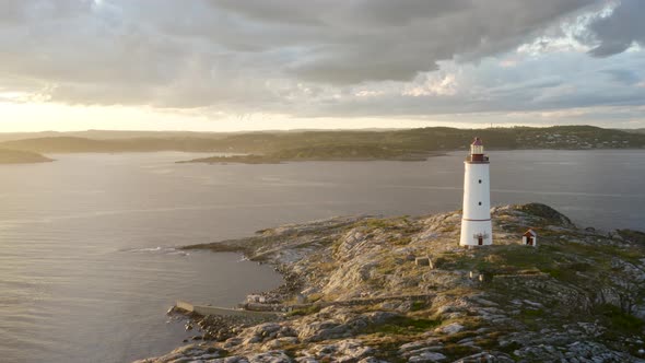 Sun Shining Over Skaggerak And Coastal Lighthouse At Lille Torungen Island In Norway. - aerial