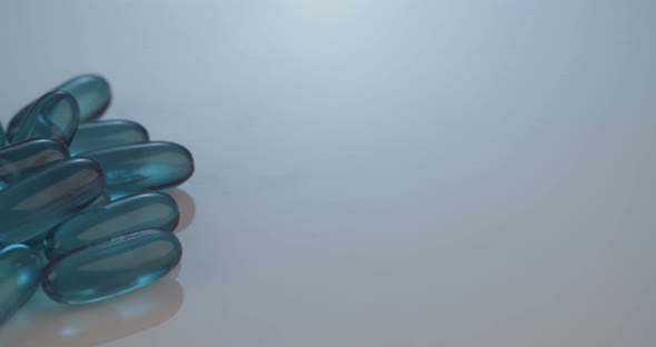 Prescription drugs - Capsules, pills, tablets on reflective background