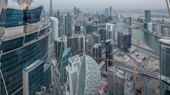 Panoramic Aerial View of Business Bay Towers in Dubai Day to Night Timelapse