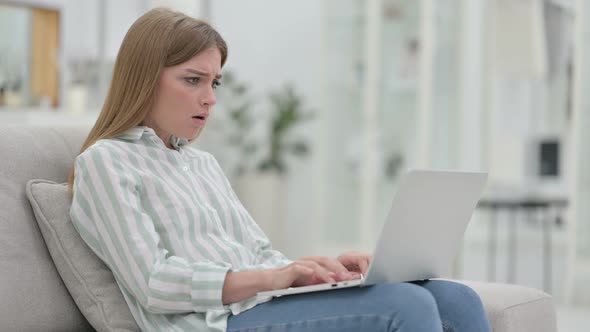 Stressed Young Young Woman Working on Laptop at Home