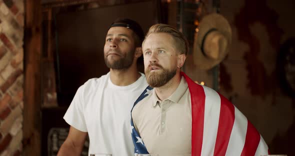 Soccer Fans Celebrating Victory of Team in Sports Bar