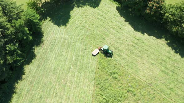 Green Tractor Hay Cutter Trees Aerial View