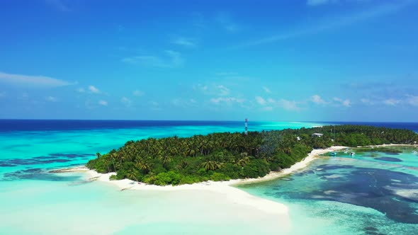 Tropical overhead abstract view of a sandy white paradise beach and aqua blue ocean background in vi