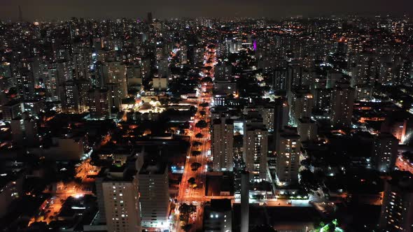 Night city landscape at downtown district. Buildings and traffic.