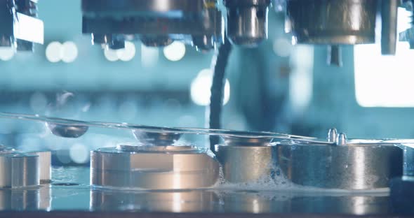 Close up shot of a punch press forming metal parts