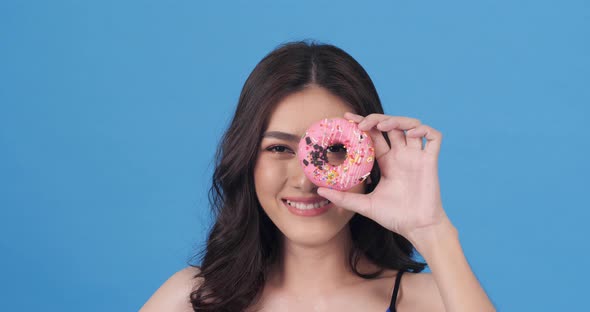Woman taste donut