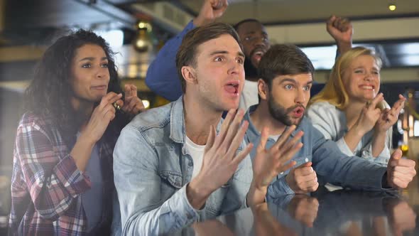 Young Men and Women Watching Sport Championship Looking Unhappy, Team Loss