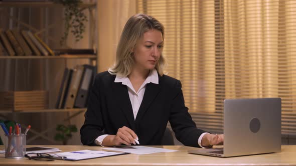 Businesswoman Checking and Signing By Pen Contract