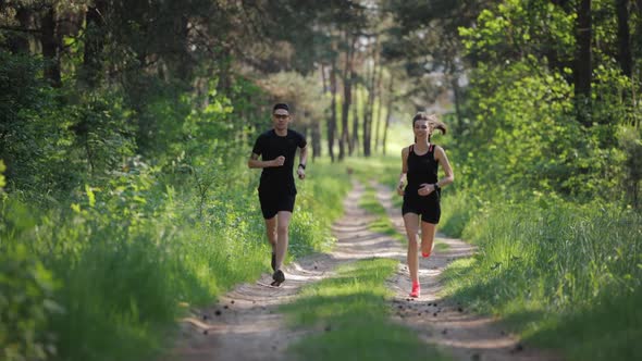 Young People Running at Forest