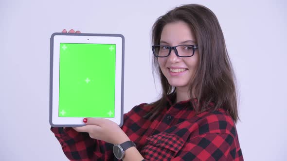 Face of Happy Young Beautiful Hipster Woman Showing Digital Tablet