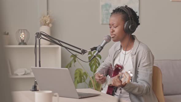 Black Woman Recording Song at Home