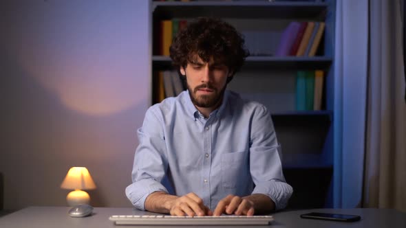 POV Shot of Angry Man Throwing Wireless Keyboard Off Table During Working on Computer at Home Office