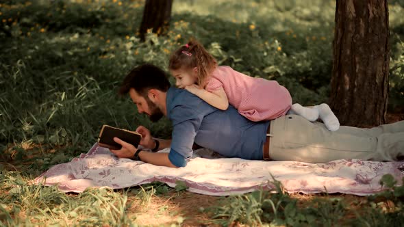 Daddy Watching Fairy Tale Story On Mobile Phone Screen. Dad Teach Preschool Child Girl.