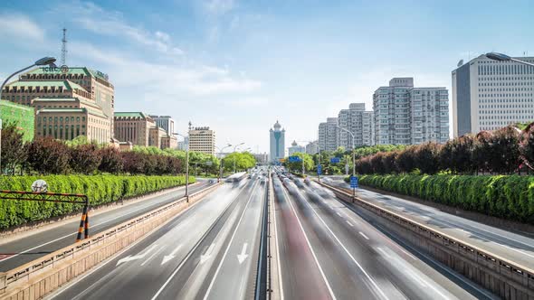 Time lapse of busy traffic and modern buildings in Beijing city , China.