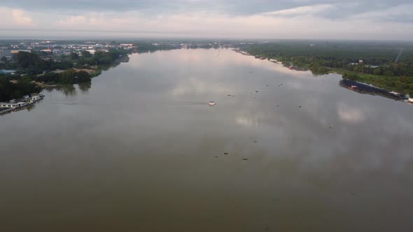 Aerial view small boat move at river