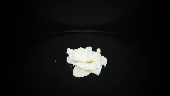 Addictive cocaine illegal drug product on black turntable