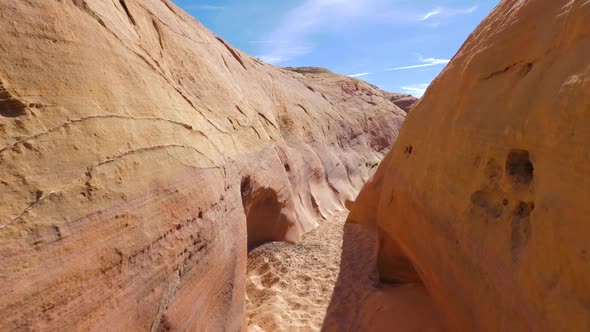 Camera Movement On A Dry Gorge With Smooth And Wavy Rocks Of The Red Canyon 