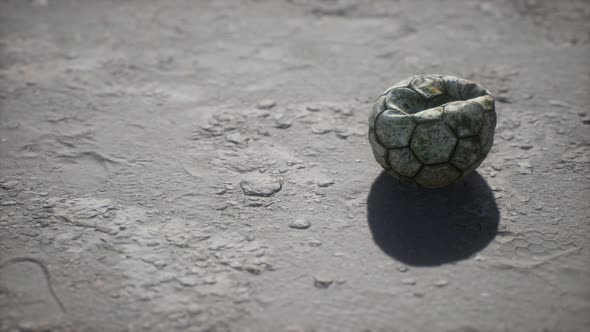 Old Soccer Ball the Cement Floor