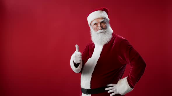 Portrait of Santa Claus Making Thumbs Up