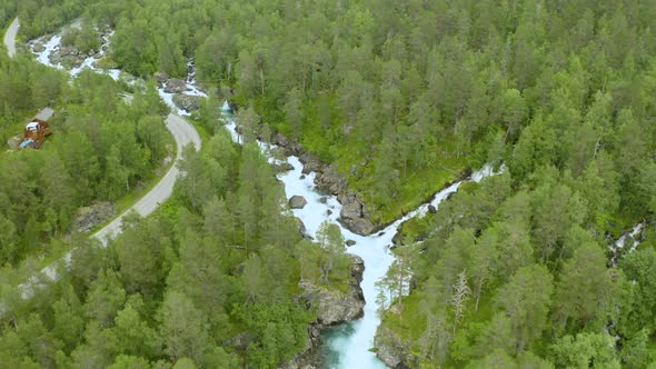 Panoramic View Of Forest And Rocky Stream In Gudbrandsjuvet, Norway - aerial shot