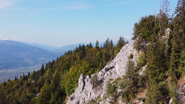 Nice aerial view of the french Alps in Autumn. Green and brown leaves.