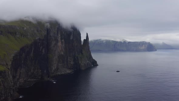 Drone Along Coastline Over Vagar With Trollkonufingur