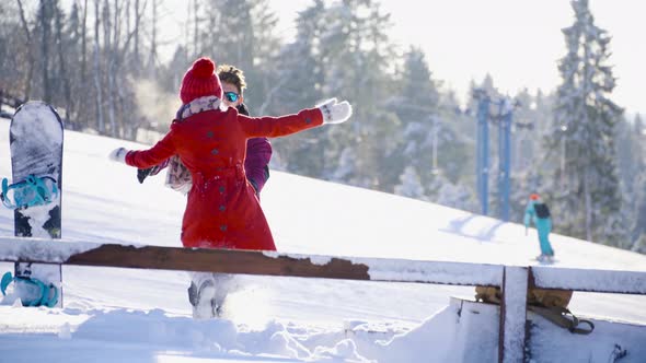 Multicultural Coulple Dating in Mountain Ski Resort at Sunny Day