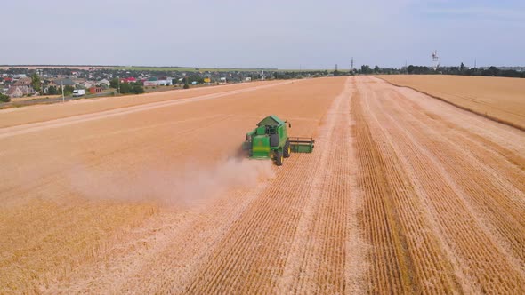  Impressive Flight Over a Working Combine Harvesting Tons of Ripe Barley